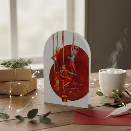 Romantic illustrated Christmas card with nutcracker ballet figures and the words “Believe in Christmas Magic”