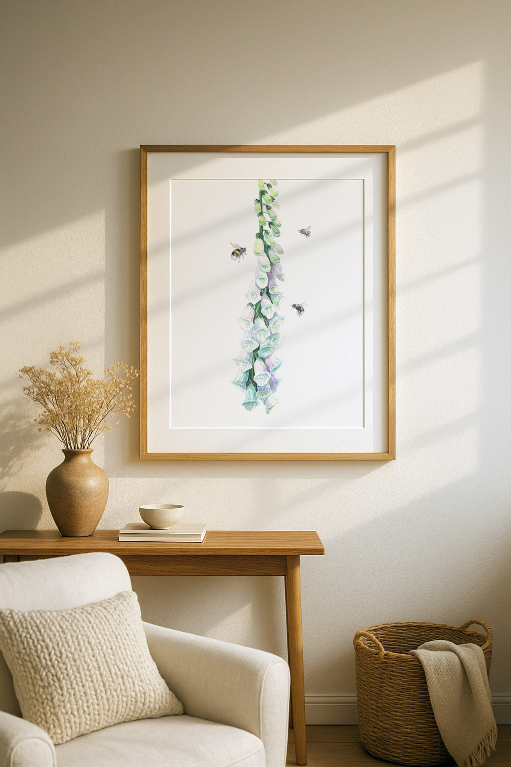 Watercolour illustration of a tall foxglove stem with pale purple and green bell-shaped flowers, accompanied by three bees flying around the blooms on a white background