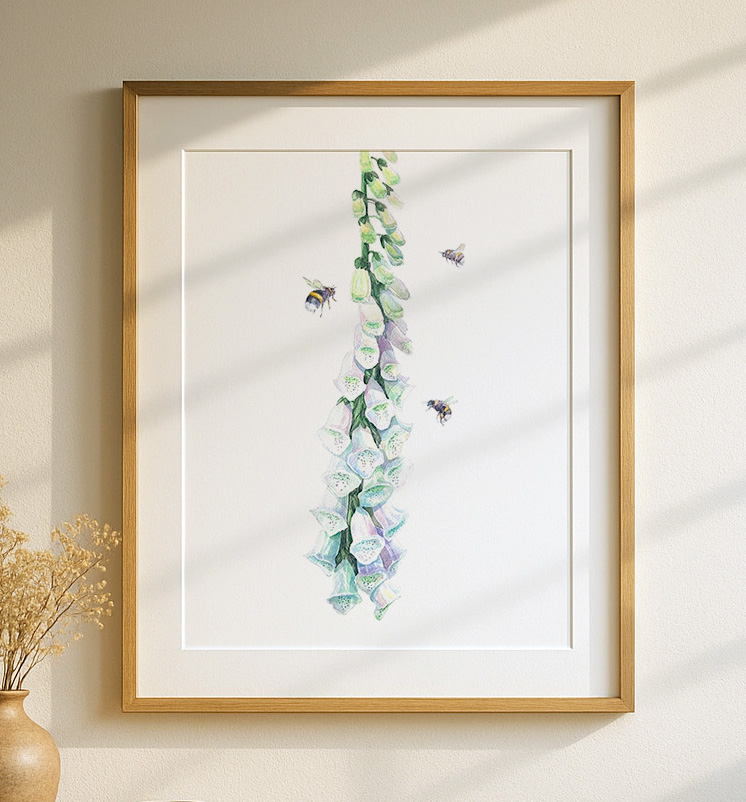 Watercolour illustration of a tall foxglove stem with pale purple and green bell-shaped flowers, accompanied by three bees flying around the blooms on a white background