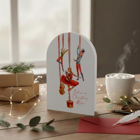 Romantic illustrated Christmas card with nutcracker ballet figures and the words “Believe in Christmas Magic”